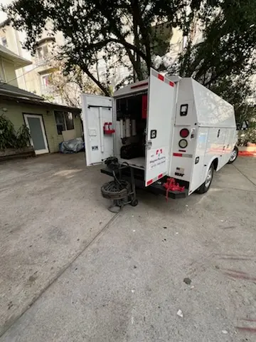 Magnet Plumbing service vehicle on-site for Grease Trap Cleaning in Nassau Bay